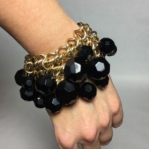 Gold tone and black bead bracelet